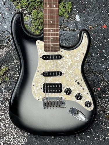 2013 Fender Stratocaster American Deluxe w/the coolest Silver'burst finish ever.