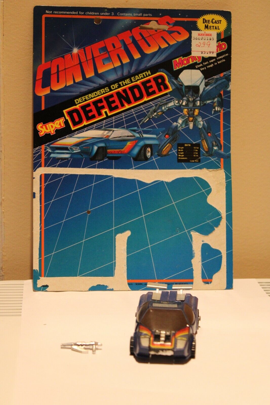 Select Convertors Super Defender Monty Carlo figure with Card back and weapon 