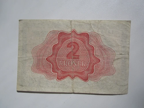 1950 Norway 2 kroner banknote with red border, silver KRONER text, and ornate geometric pattern on front.