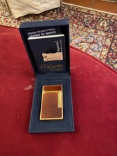 Accendino Dupont placcato oro con scatola e certificato originale.