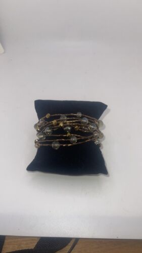 Cookie Lee lot of 10 bronze and clear bead stretch bracelets.