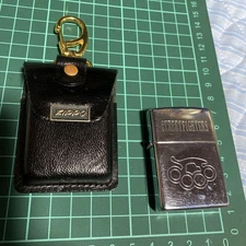 Zippo Street Fighter Knuckle Oil Lighter with Leather Case Used