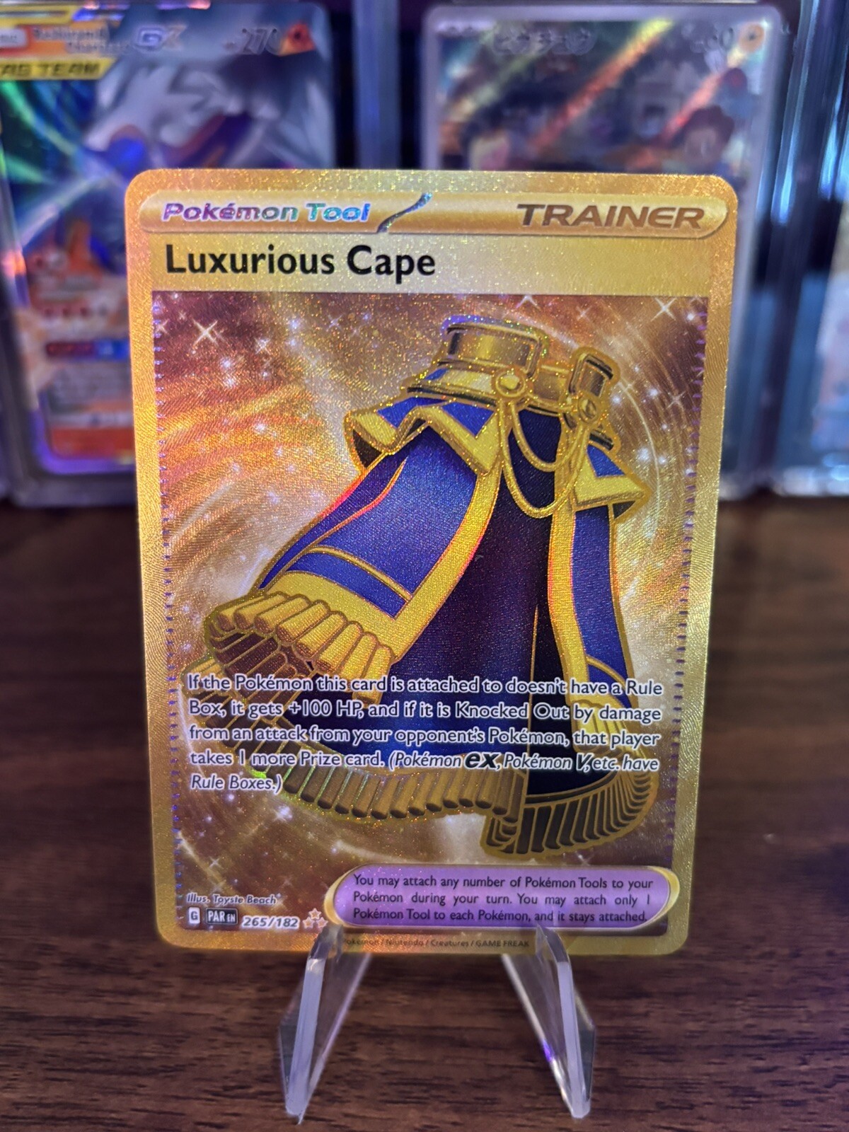 Pokémon TCG Luxurious Cape 265/182 Gold Holo Trainer Full Art - Paradox Rift