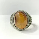 Sterling silver ring set with striped Sulaymani agate, light-transmitting.