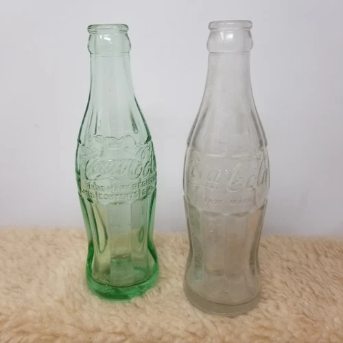 2 Vintage Coke Bottles - 1 Clear 1 Green Tint - Macon GA See Pics