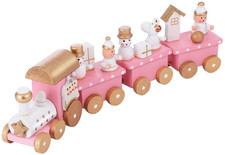 Wooden miniature train set for Christmas party decoration under the pink tree