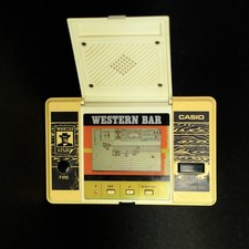 Casio CG-300 Western Bar Japan gioco portatile vintage, molto ingiallito, non funzionante