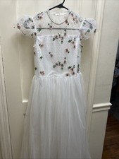 Girls White Tulle Gown With Pink And Green Floral Accents On Top.
