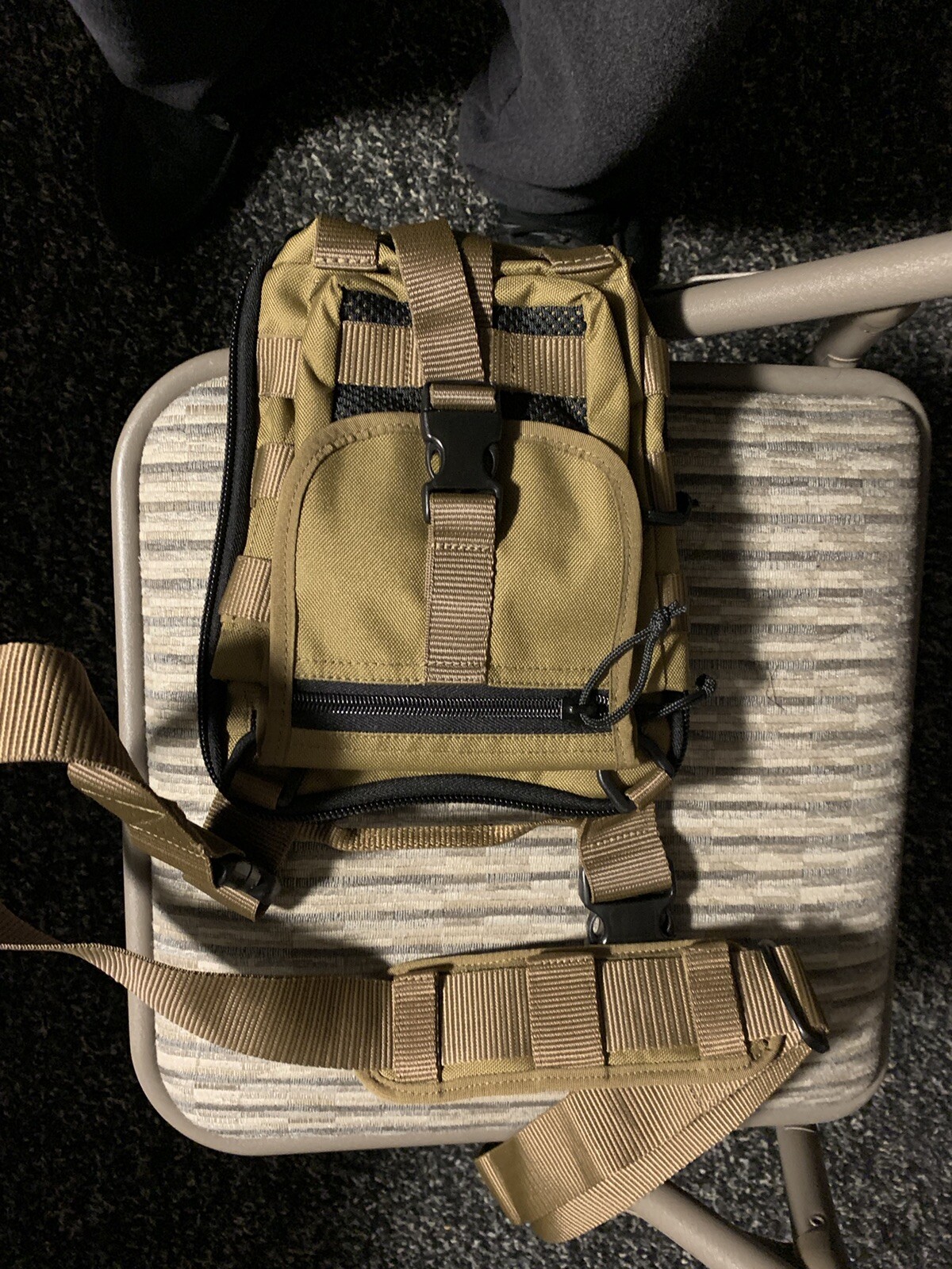 Desert tan tactical shoulder bag with multiple pouches and internal pistol holder-image