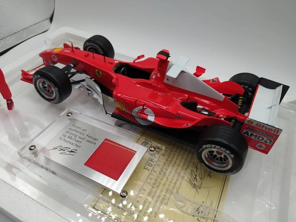 FERRARI F2004 M. SCHUMACHER 7 WORLD CHAMPION - HOTWHEELS RACING 1/18 - Immagine 2 di 4