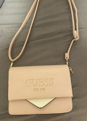 Rarely good condition rose pink Guess crossbody bag with an embossed logo