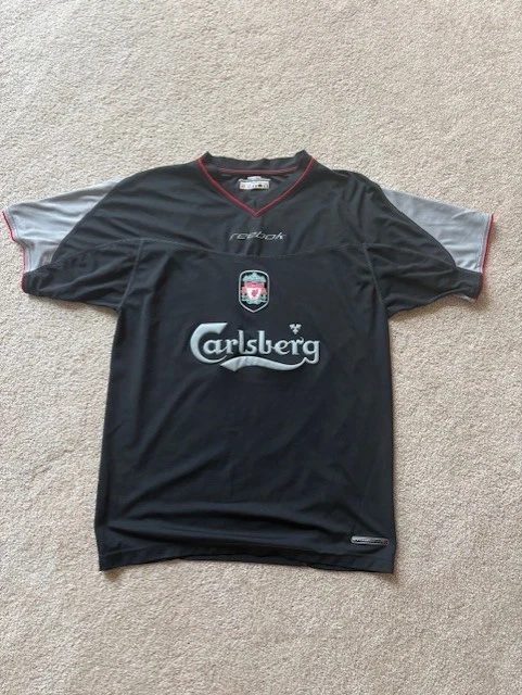 Preços baixos em Reebok Liverpool Preto Clube Internacional de
