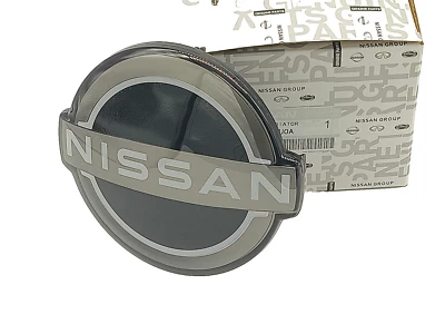 NEU ORIGINAL 628906RM0A FÜR NISSAN ROGUE 2019-2022 Kühlergrill Emblem - Bild 1 von 4