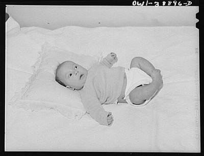 Photo:1930s Baby in Crib Infant Portrait Sleeping Diaper Pillow