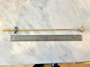 A gold plated Sherle Wagner sink drain pull