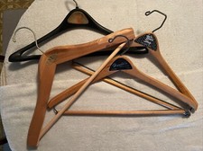 3 Vintage Wood Coat Suit Hangers  1 Vintage Plastic Suit Coat Hanger.