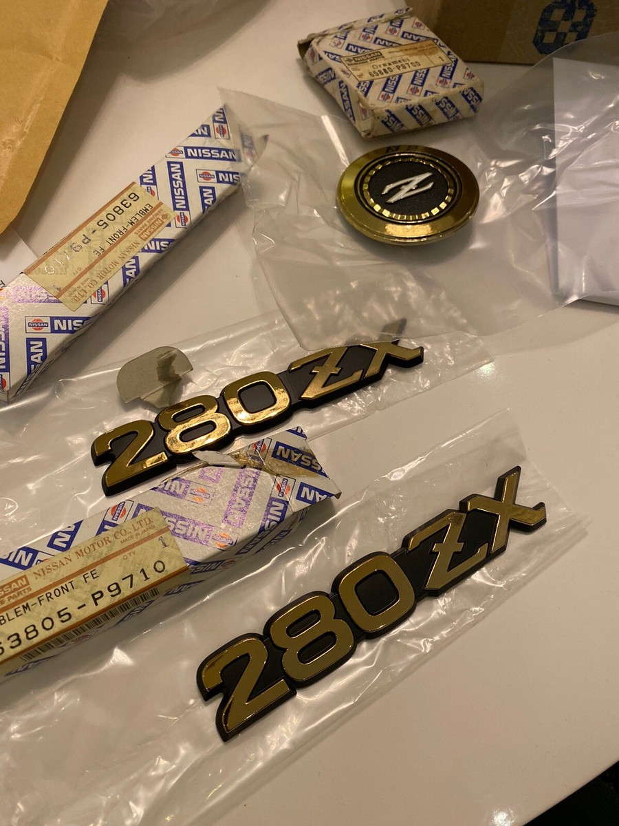 Datsun 280ZX Nissan Gold Plastic (Three) Emblems Datsun 280ZX Nissan Gold Plastic (Three) Emblems