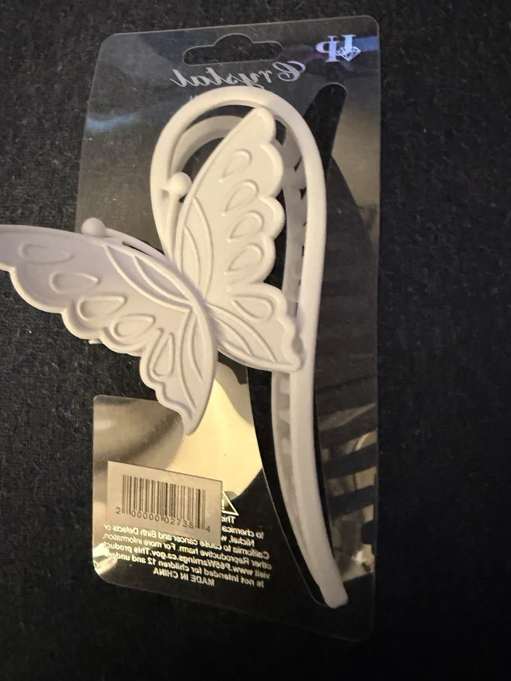 Garra de pelo de mariposa blanca de cristal Foto 4 de 4