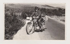 Young Motorcyclist in Full Gear Takes the Road on His Sleek and Powerful Machine