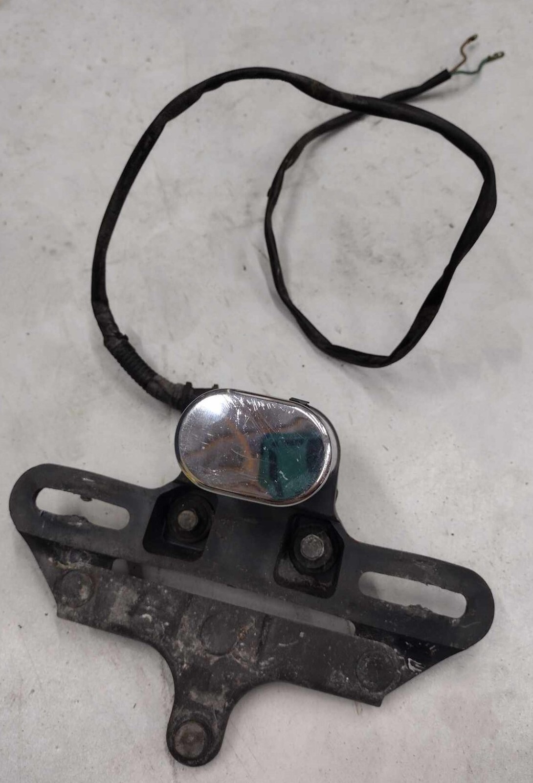 Honda OEM License plate bracket light 33720-MR1-672 VT600 Shadow  