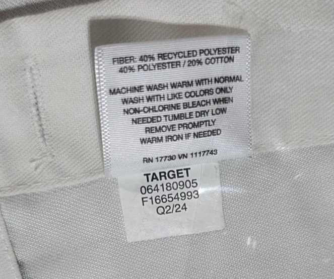 Cortina de ducha Target Trazos pintados de tela verde con 12 ganchos blancos Foto 3 de 4