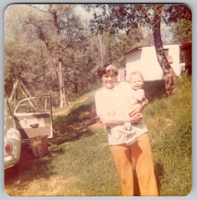 Vtg Color Snapshot Woman Holding Baby Outdoors By Vw Beetle Bug Car 1970s