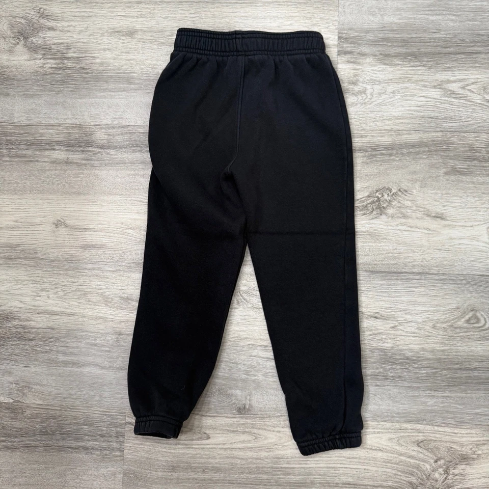 Pantalones deportivos Under Armour para niños negros de vellón talla 6 Foto 4 de 4