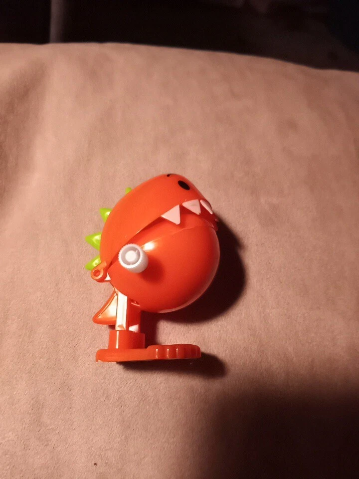 Brinquedo de corda dinossauro laranja - Imagem 2 de 4