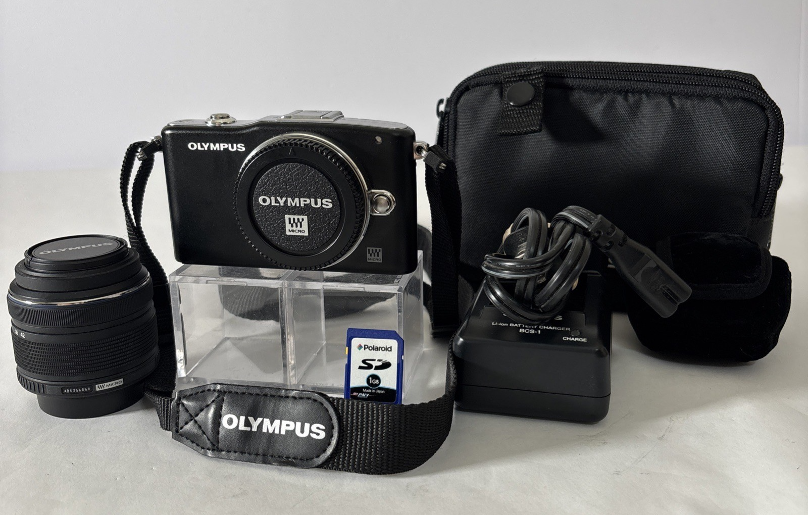 Olympus Pen Mini E-PM1 Mirrorless Digital Camera Black w/ 14-42mm Lens, Case