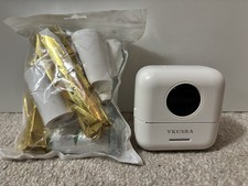 Vkusra Thermal Label Printer with all the rolls in the image
