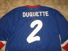 SPOKANE AMERICANS HOCKEY HEROES & LEGENDS DUQUETTE #2 JERSEY BY ALPHA SPORTSWEAR