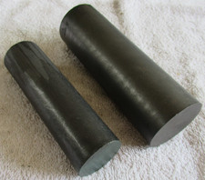 Two graphite rods/cylinders, 150mm x 50mm & 130mm x 37mm, total weight 810g
