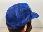 Blue US-made wide-stripe trucker hat with white and red shoulder panels and embroidered “VTG Chicago Cubs” text on front.