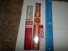 2 Vintage Colgate Toothbrushes  89  69 Cents 1960s plus tiny toothpaste tube
