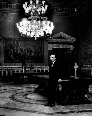 The Governor of Bank of Italy Guido Carli reading some papers at d- Old Photo
