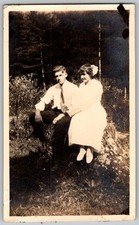 Vtg B&W Snapshot Young Couple Outdoors Seated Stump 1920s