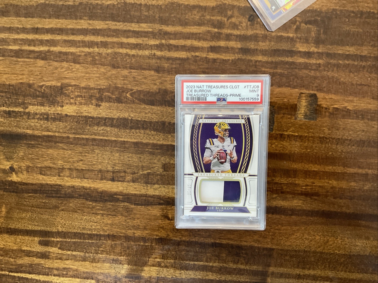 2023 National Treasures Joe Burrow 7/10 PSA 9 Patch. GAME WORN!!!