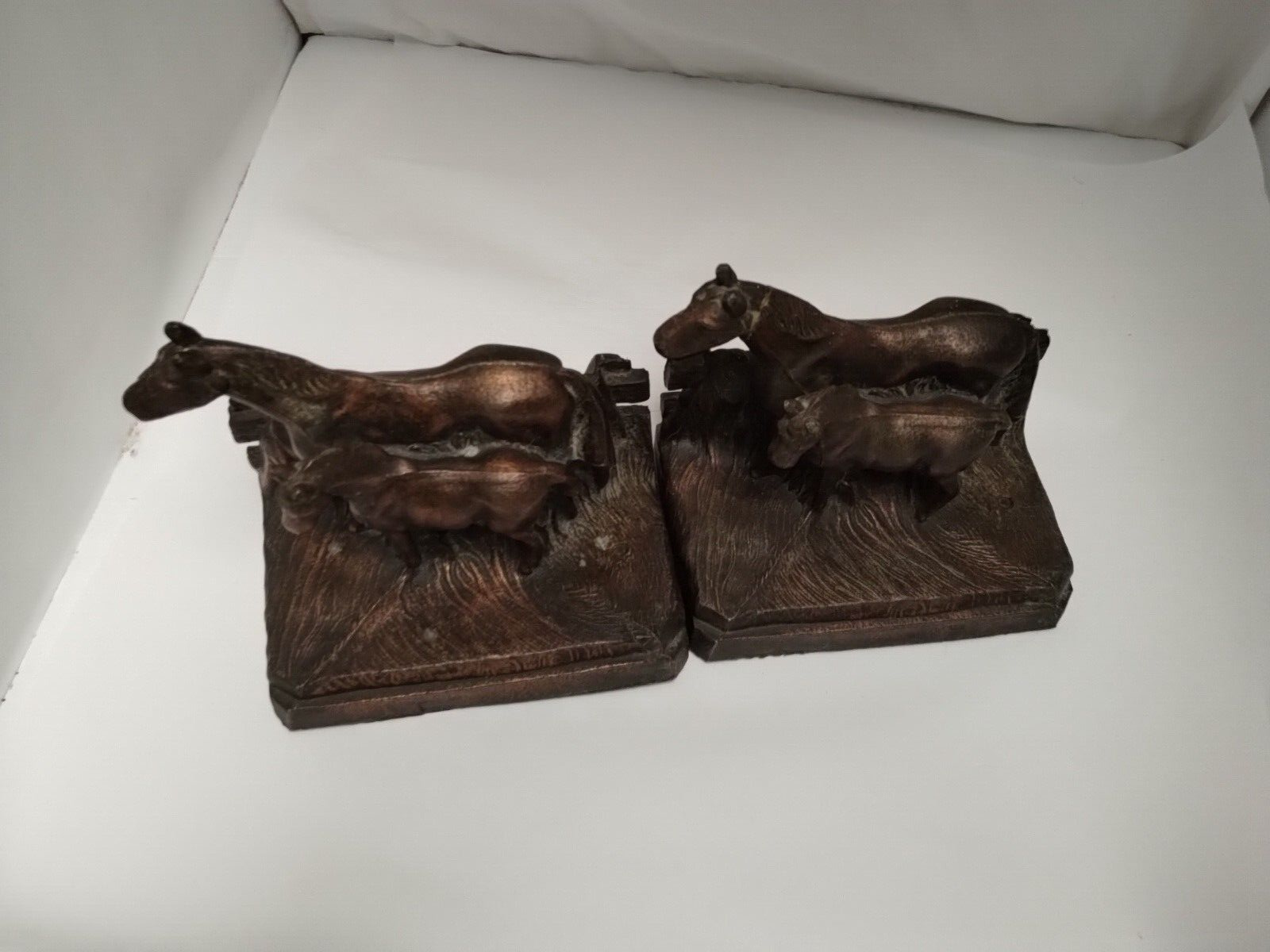 Horse book ends cast in bronze or copper hallow  light not heavy