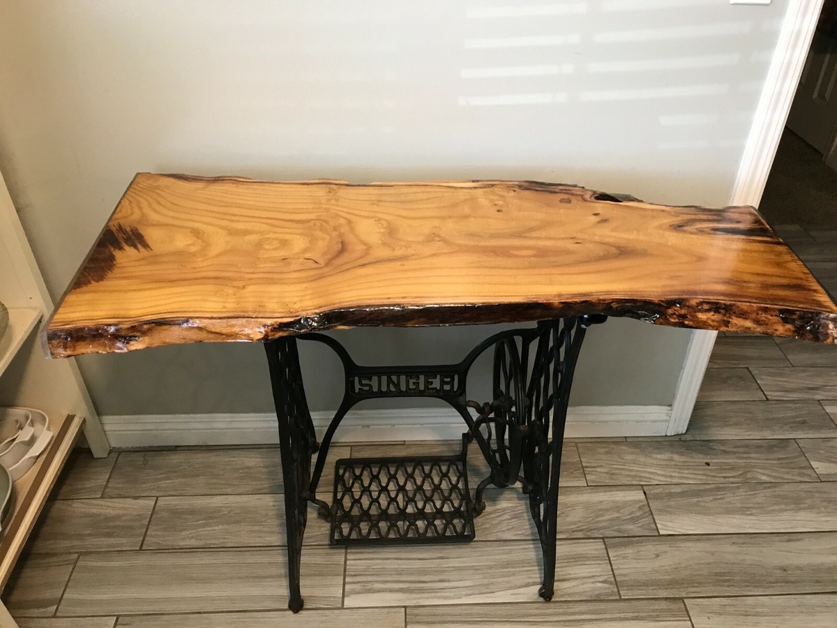 Live edge wood entry way table on vintage 1900s sewing machine