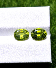 4.380cts 100 natural top quality peridot, pair oval shape, vivid green color.