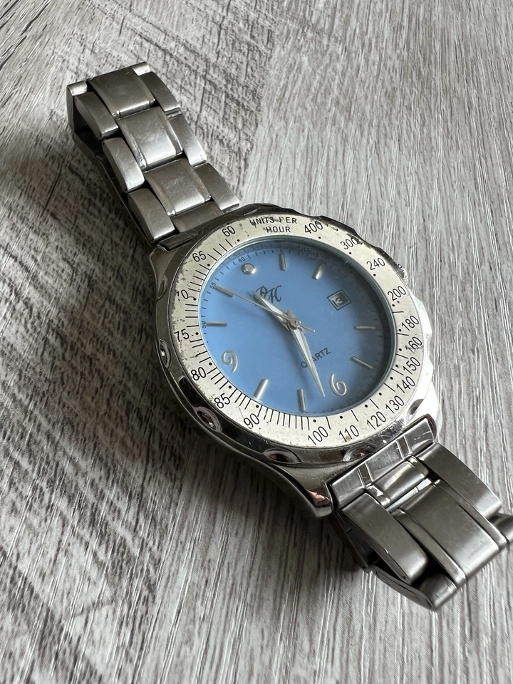 Reloj unisex Paris Hilton de cuarzo plateado con esfera azul correa de acero Foto 2 de 4