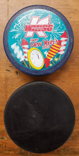 Kalamazoo Wings Hockey Pucks - Happy New Year and Black Game Puck - Used 2013