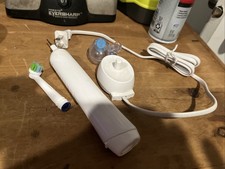 Braun Oral. B Electric Toothbrush With Charging Station Used