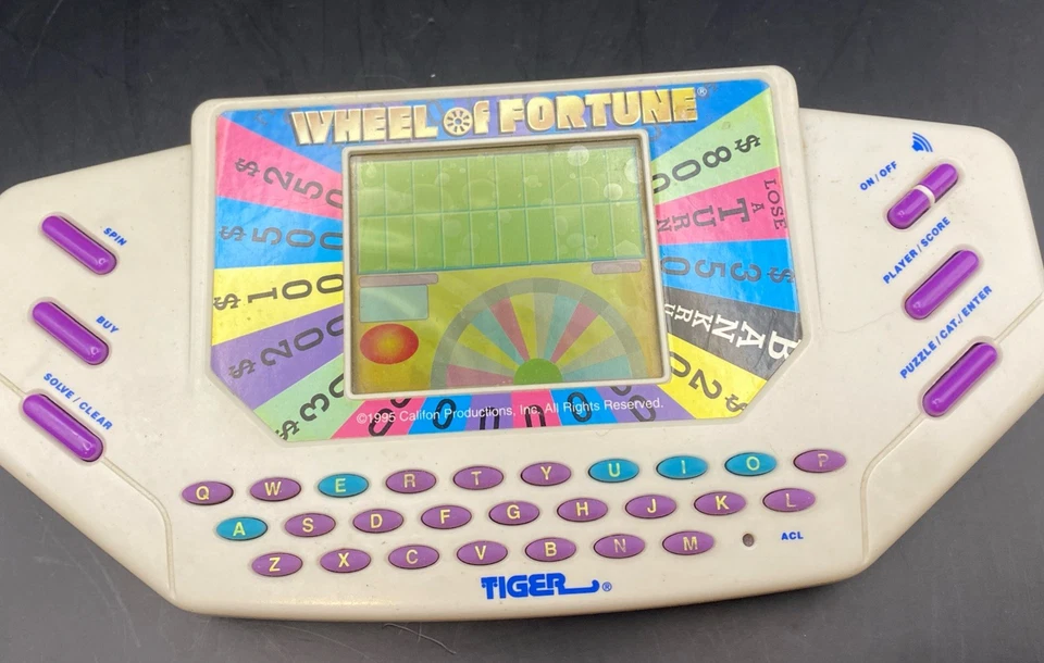 Juego portátil Tiger Electronics Wheel Of Fortune 1995 de colección con cartucho FUNCIONA Foto 2 de 4