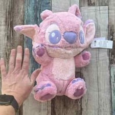 Roughly 14x9 inches Pink stitch plush