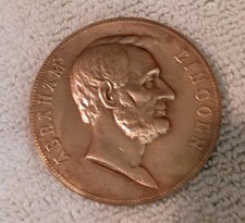 Medaglia commemorativa in bronzo con ritratto di Abraham Lincoln.