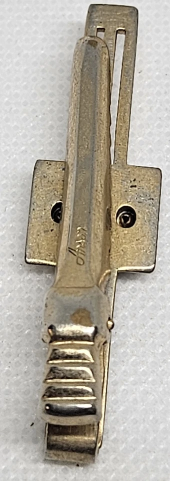 Clip de corbata vintage Anson tono dorado vidrio negro intaglio guerrero mediados de siglo... Foto 3 de 4