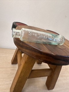 vintage bottle appears to be a collectible glass bottle