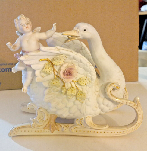 Circa 1940s German Bisque Cherub Riding Swan Sleight Figurine