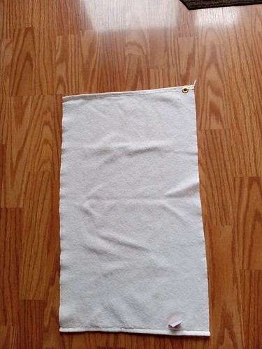 White vintage U.S. Army golf towel with subtle textured weave, two metal loops, and “Made in U.S.A.” tag.